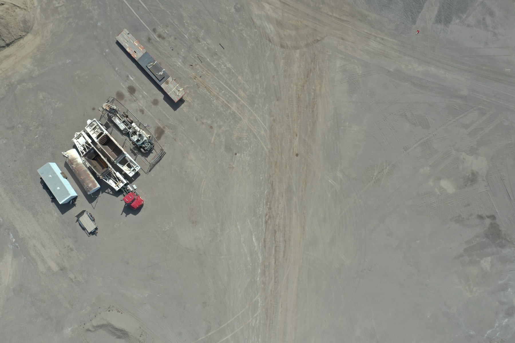 Aerial view of haul roads and material piles at a southeastern Arizona mine site