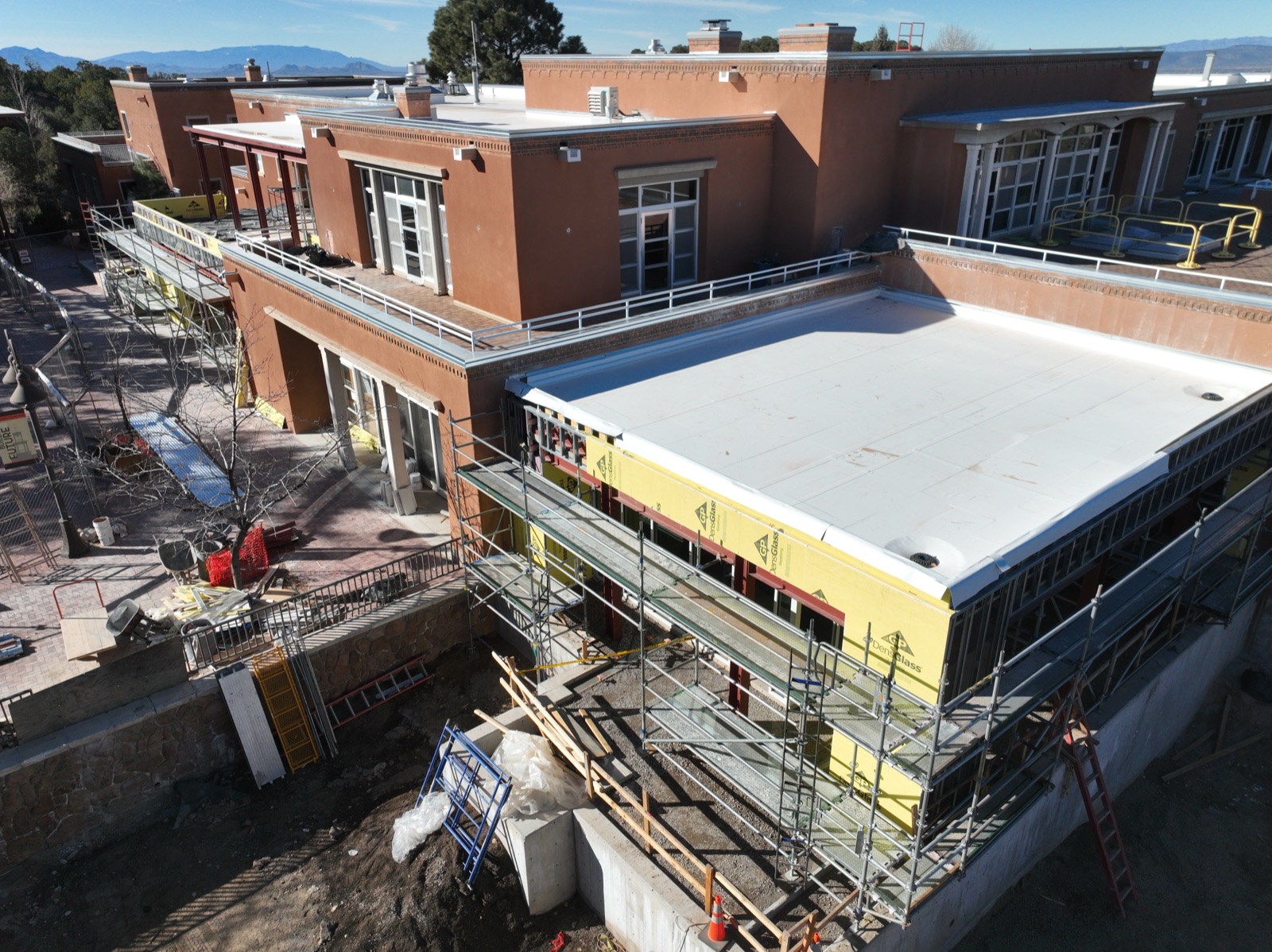 Drone photo of scaffolding and renovation work on a Santa Fe college campus building
