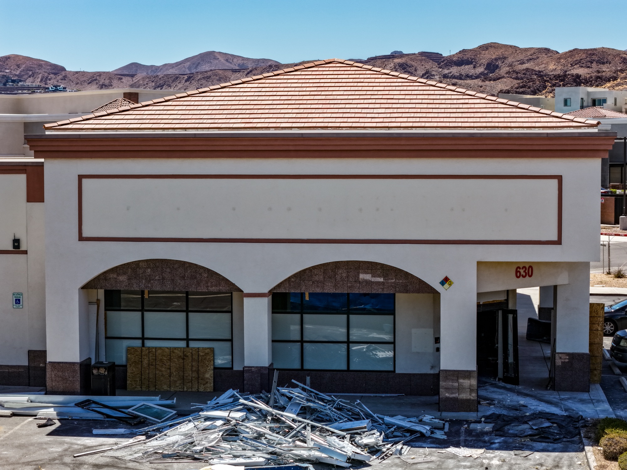Drone view of a commercial roof deck and HVAC units with the Las Vegas skyline on the horizon, Henderson NV