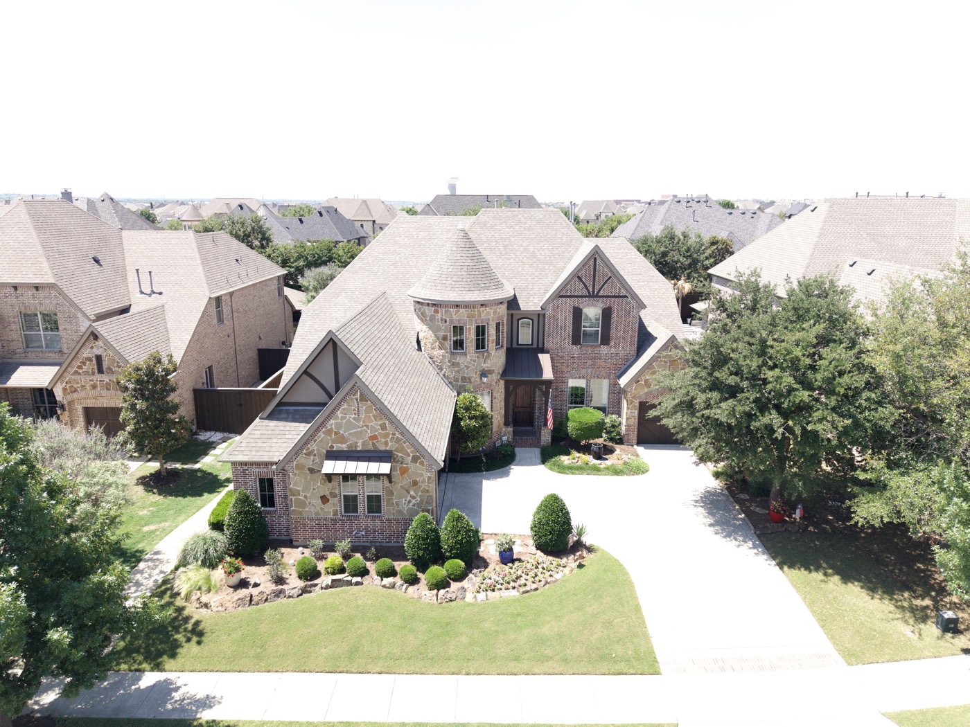 Cinematic aerial drone frame over a Dallas–Fort Worth property
