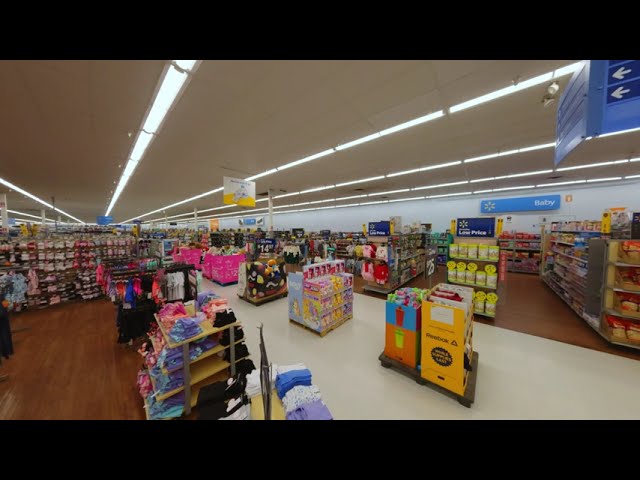 FPV drone still from a single-take retail interior fly-through