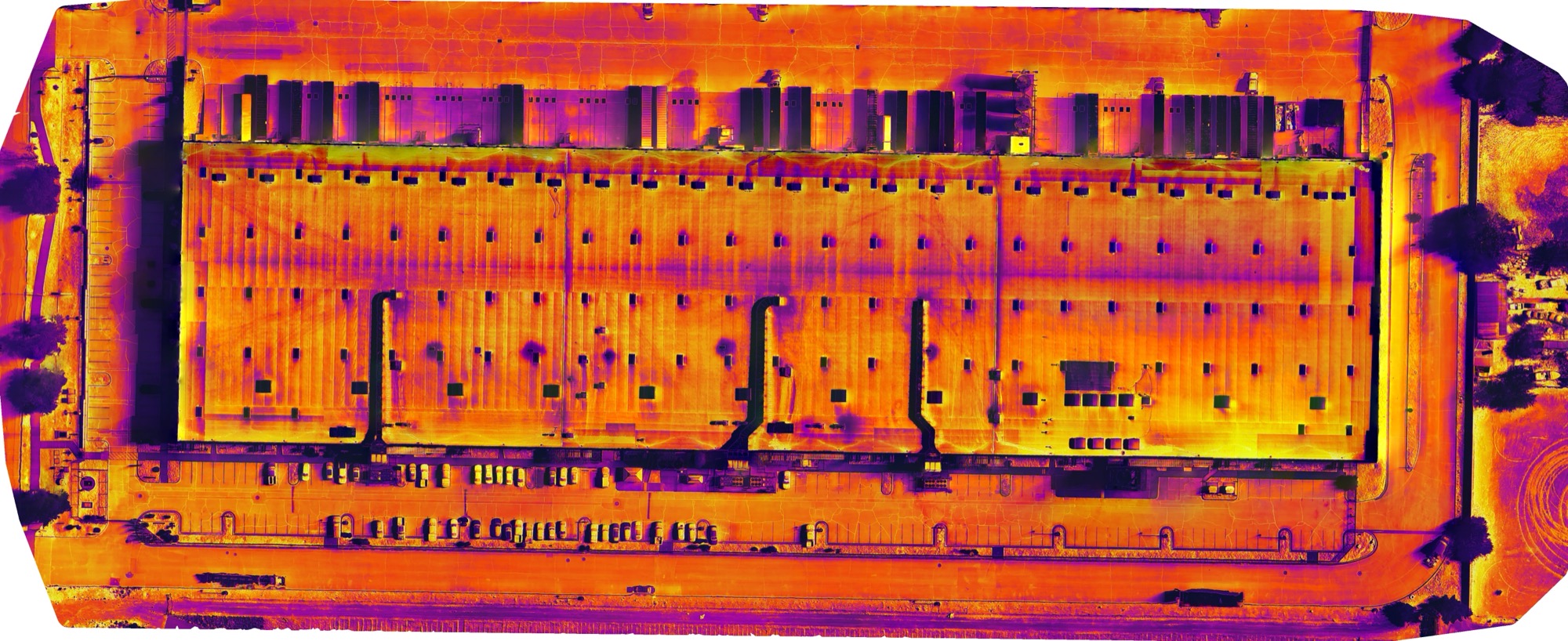 drone roof inspection dallas — aerial view of commercial rooftop during FAA-certified inspection