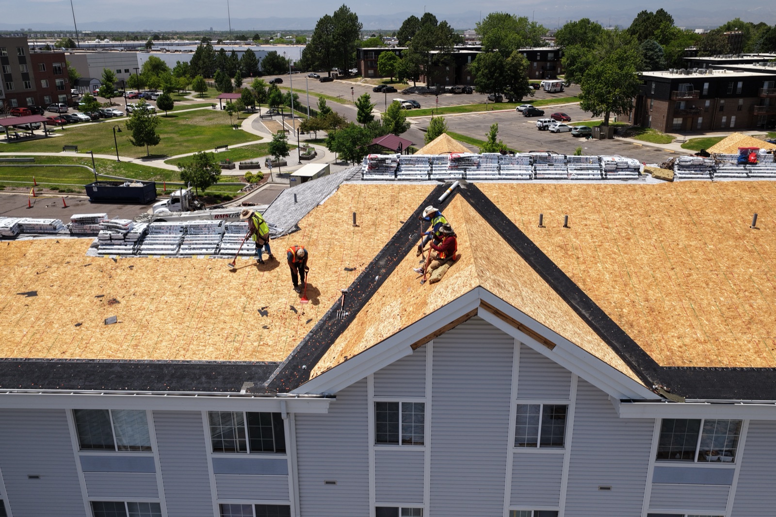 Aerial view of underlayment installation in progress on a Denver multifamily re-roof