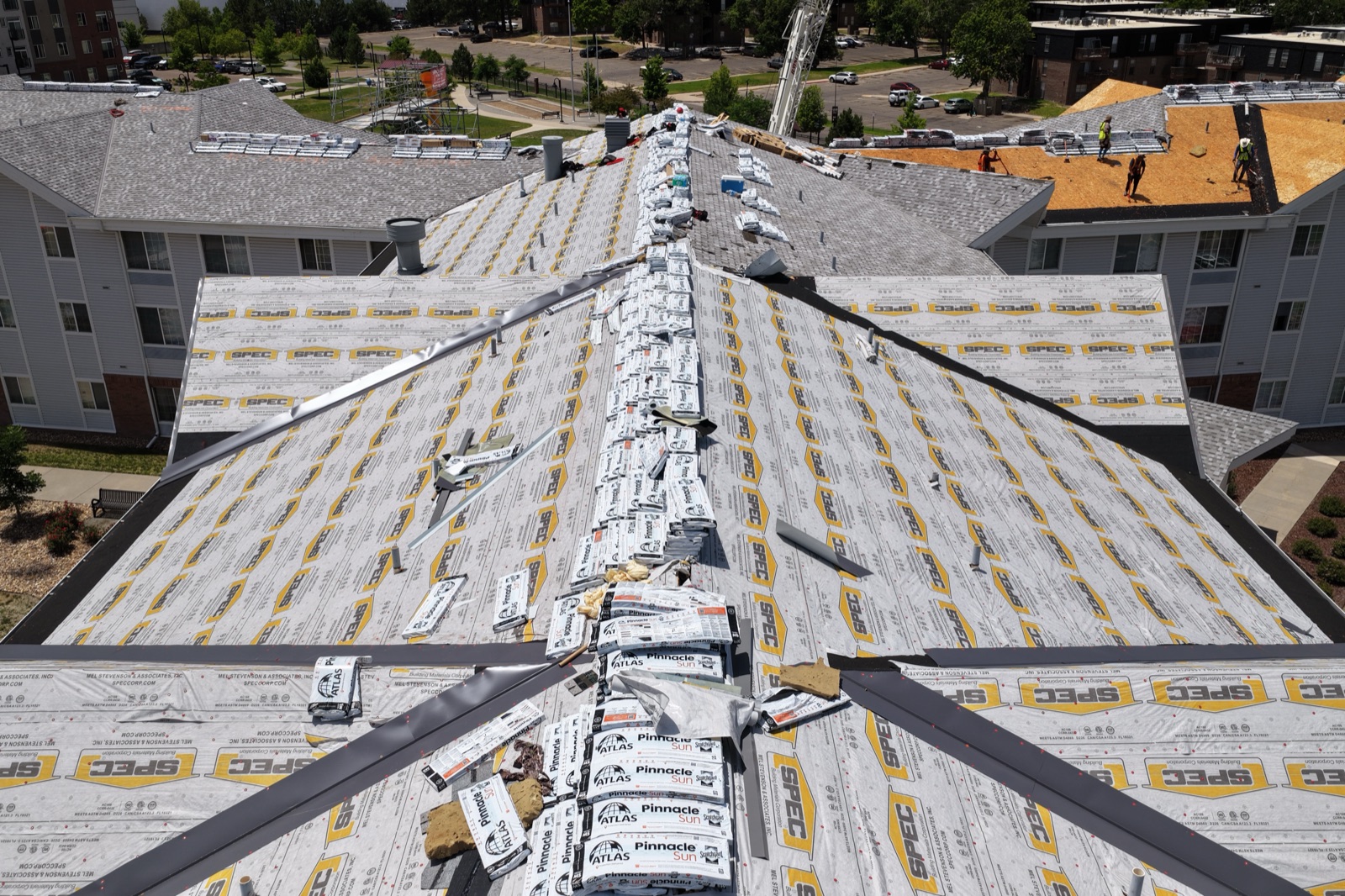 Low-altitude drone detail of roof deck and synthetic underlayment during a Denver re-roof