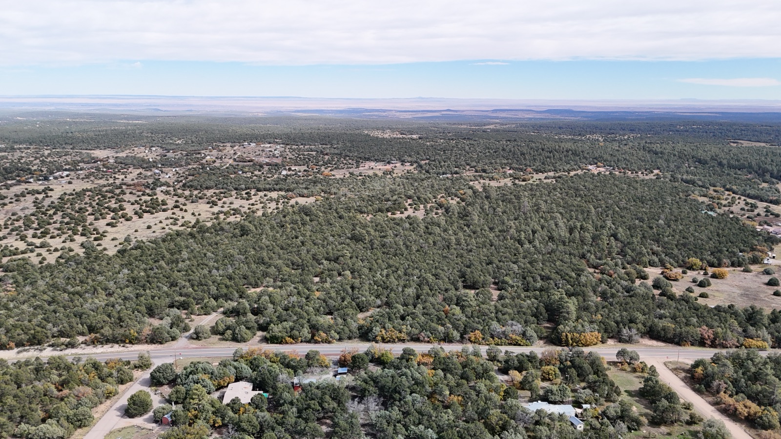 Aerial drone photo of piñon-covered East Mountains acreage near Edgewood, New Mexico
