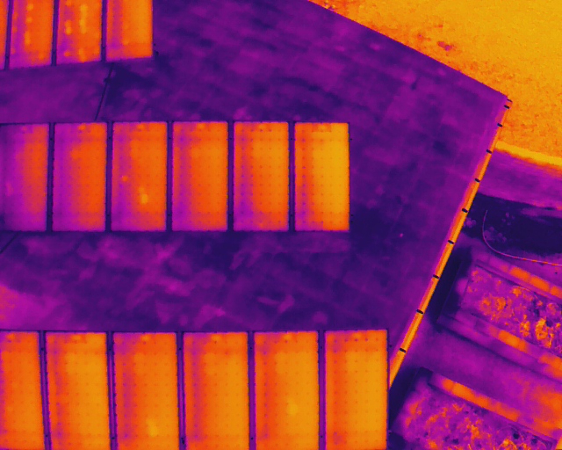 Aerial thermal view of a commercial solar array during inspection