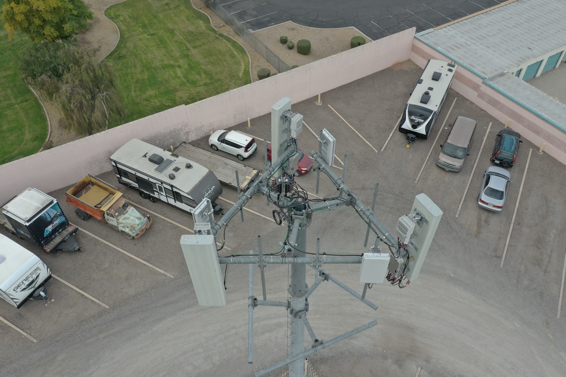 Aerial inspection view of a communications tower antenna array from above