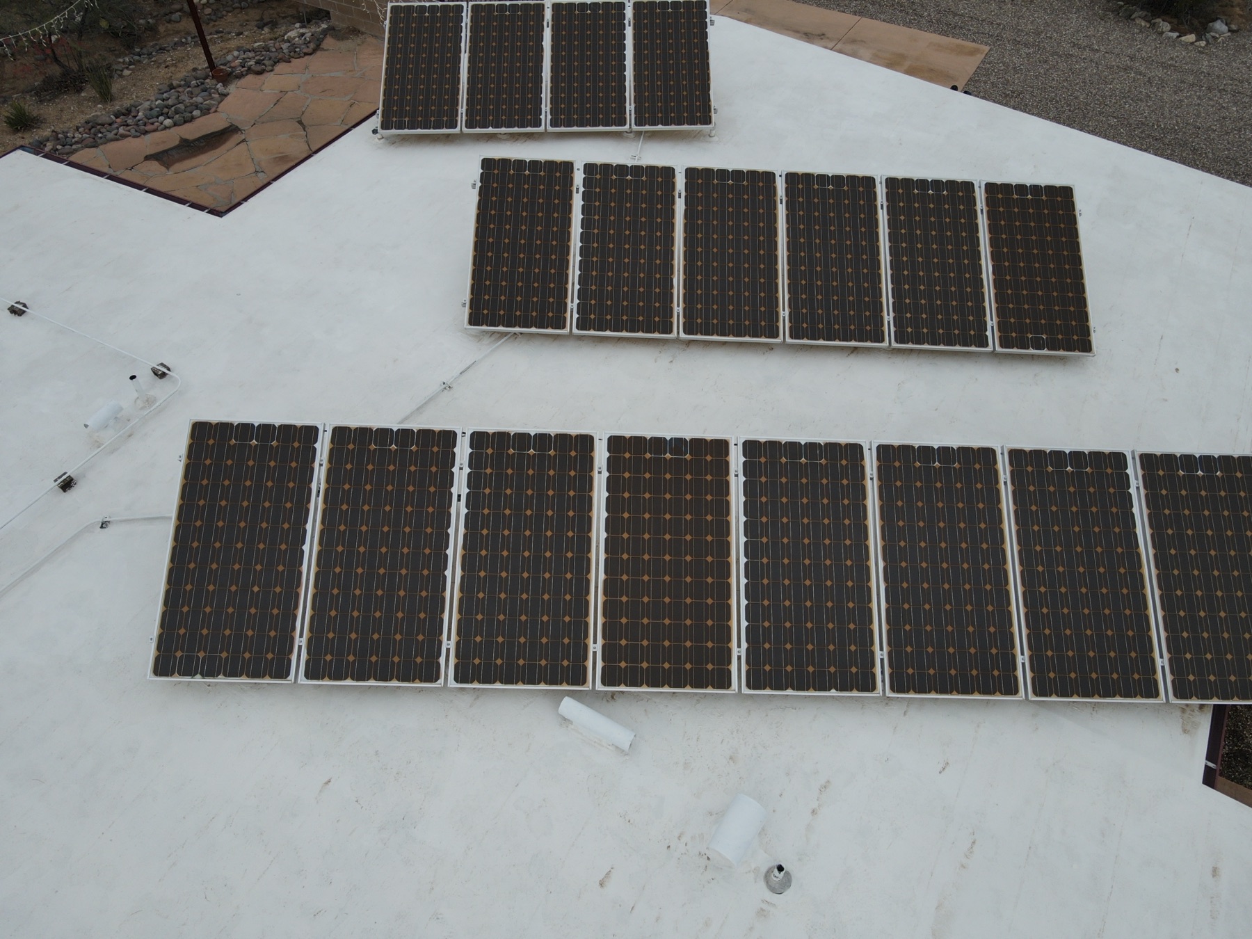 Paired visible-light aerial of a commercial roof used alongside thermal imagery