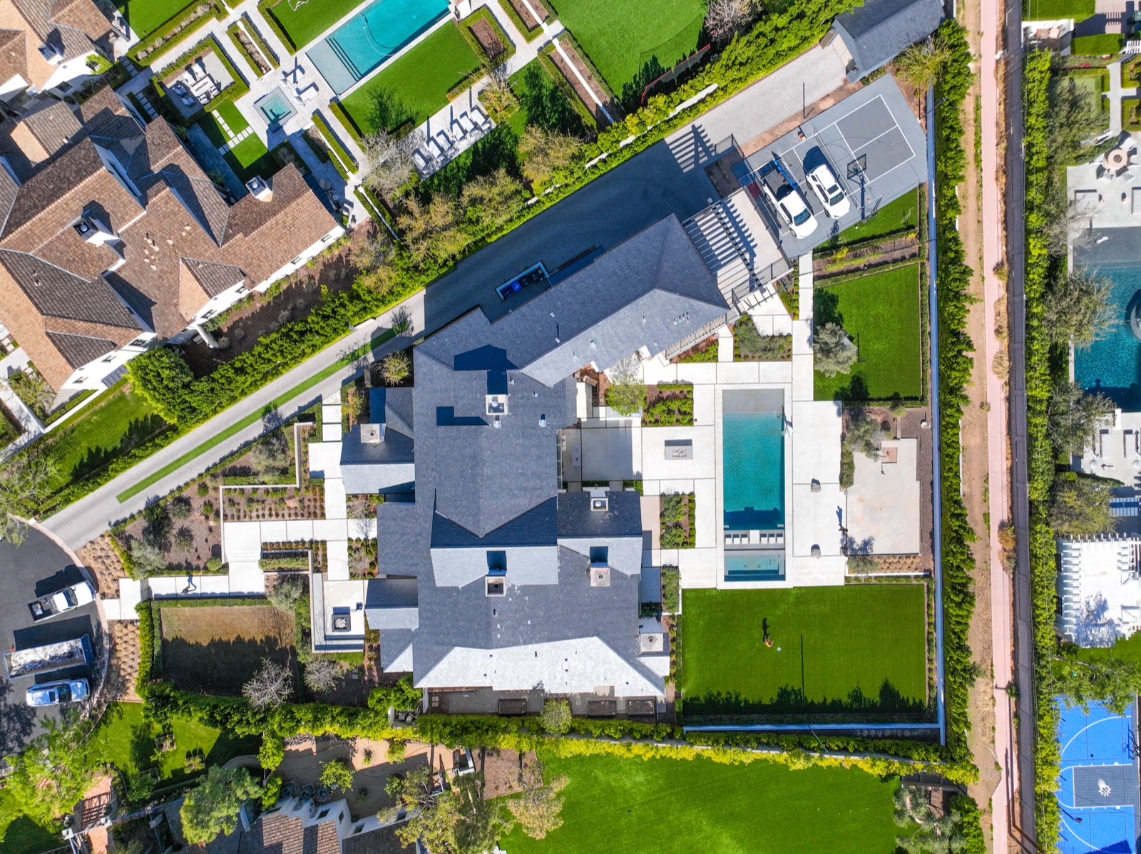 Top-down aerial of a luxury estate with pool captured for an MLS listing