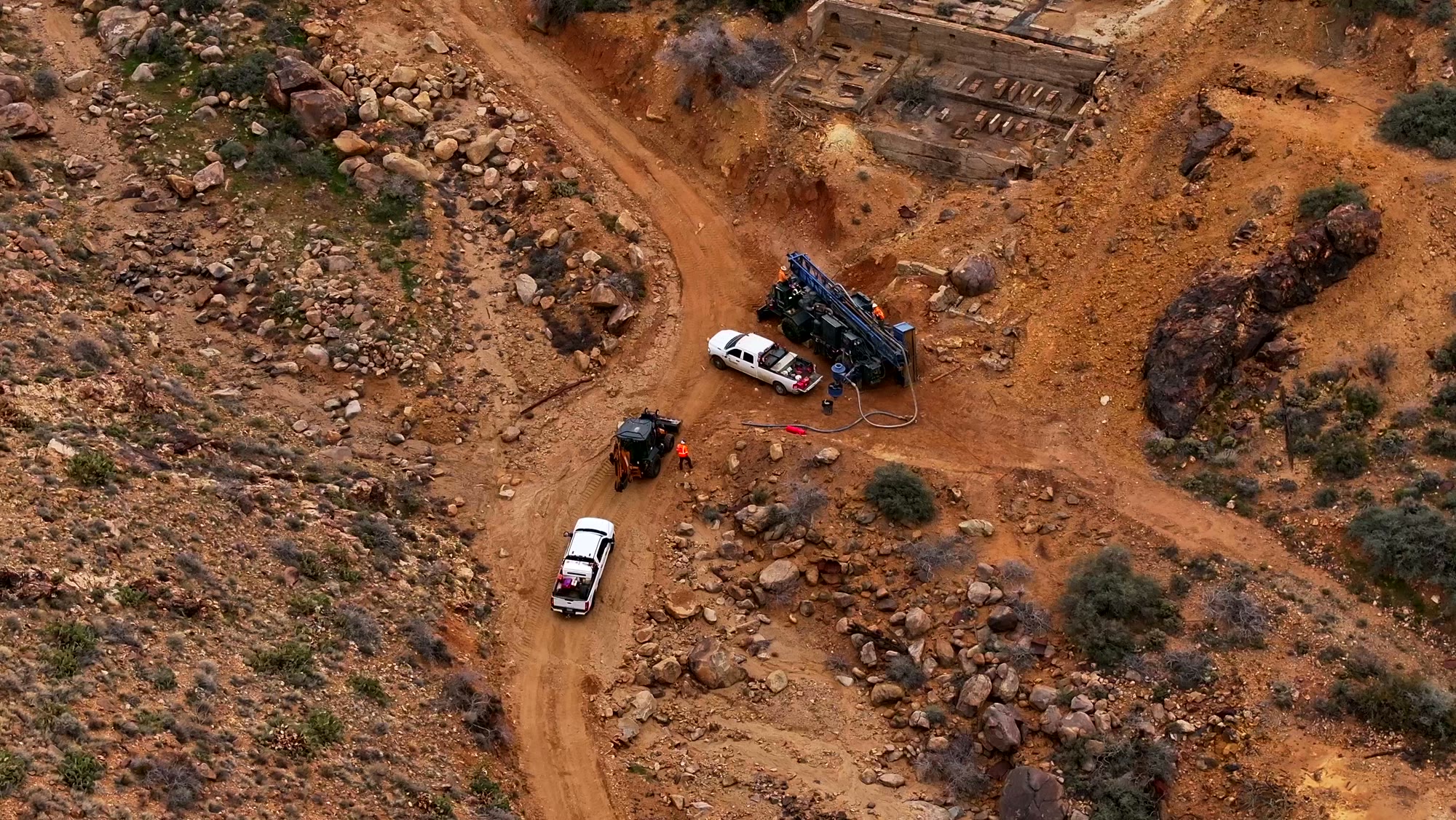 Aerial drone photo of an active drill rig and crew at a Nevada mine site