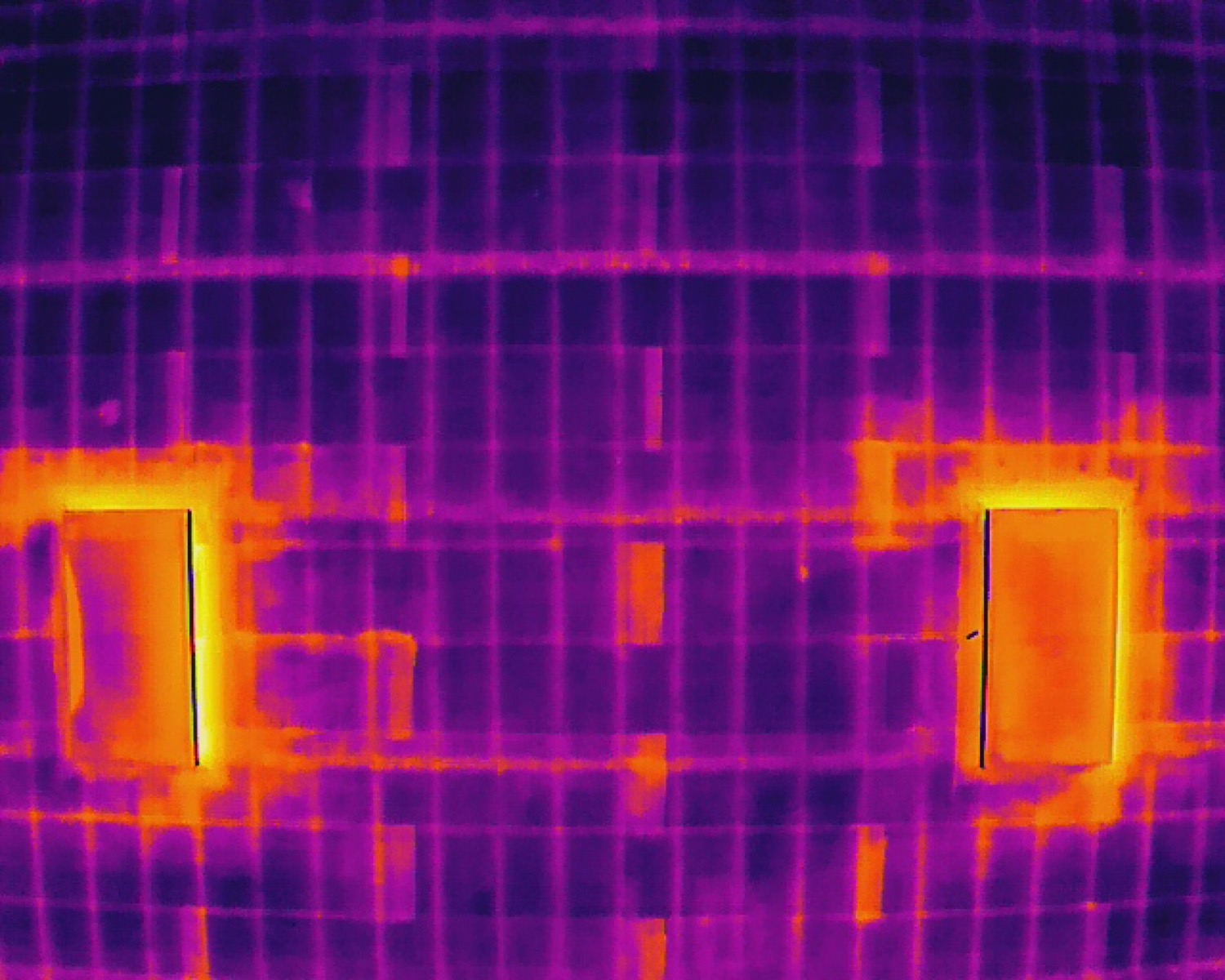 Aerial thermal drone image of rooftop equipment heat signatures on a west Phoenix commercial roof