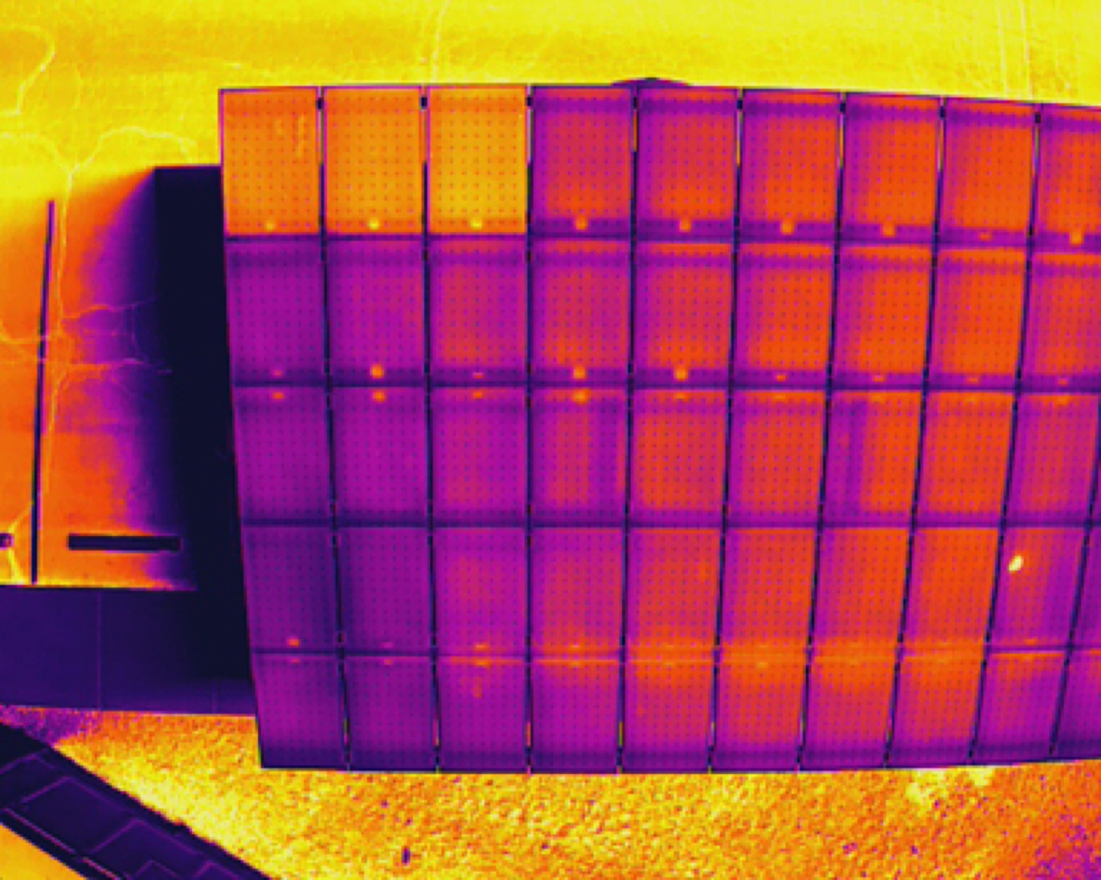 Radiometric thermal image of a solar array showing string-level temperature variation