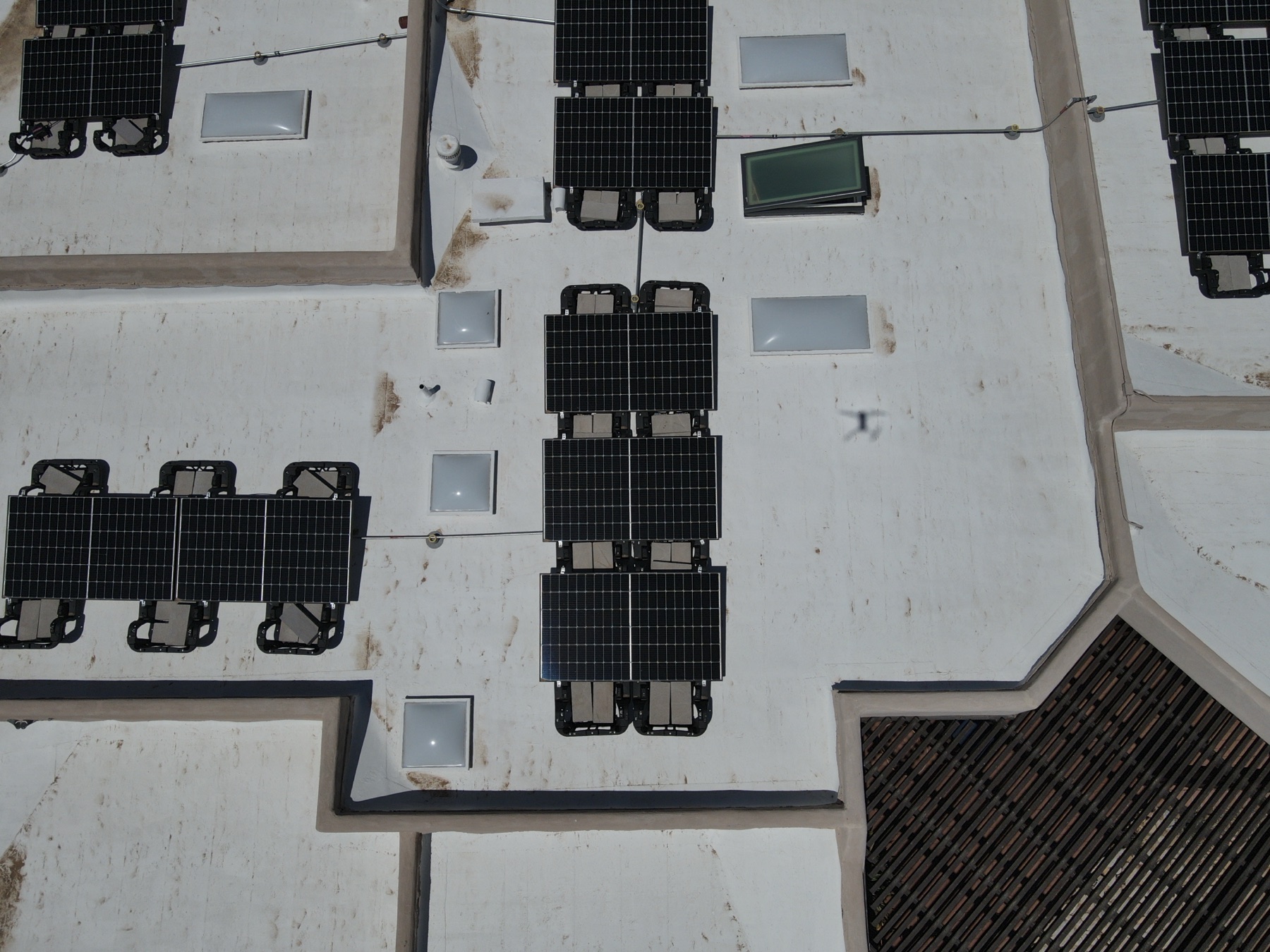 Aerial view of a rooftop solar array on an east Tucson commercial building