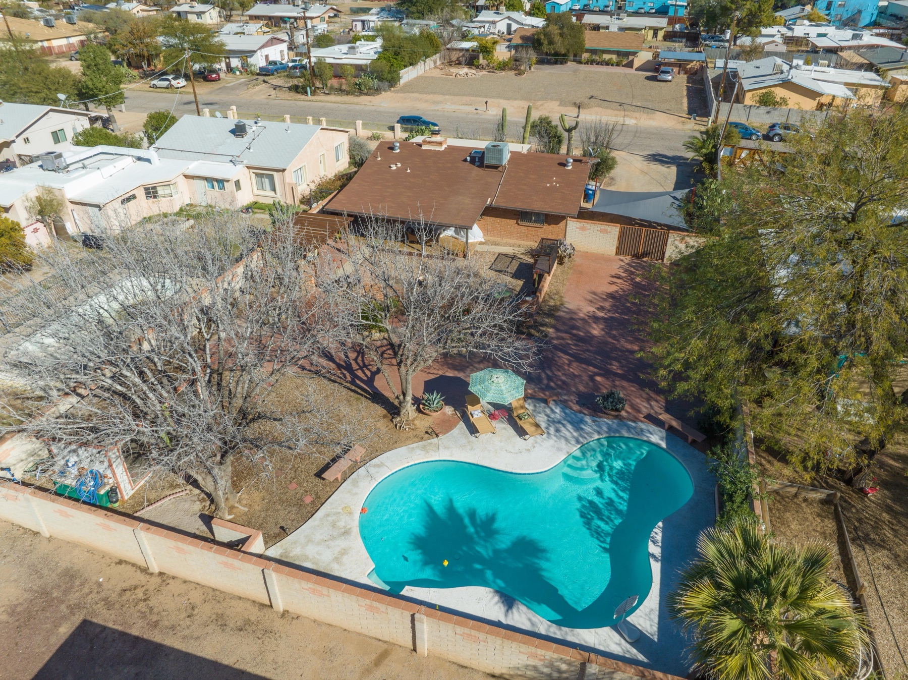 Top-down aerial of a midtown Tucson home with pool and landscaped backyard
