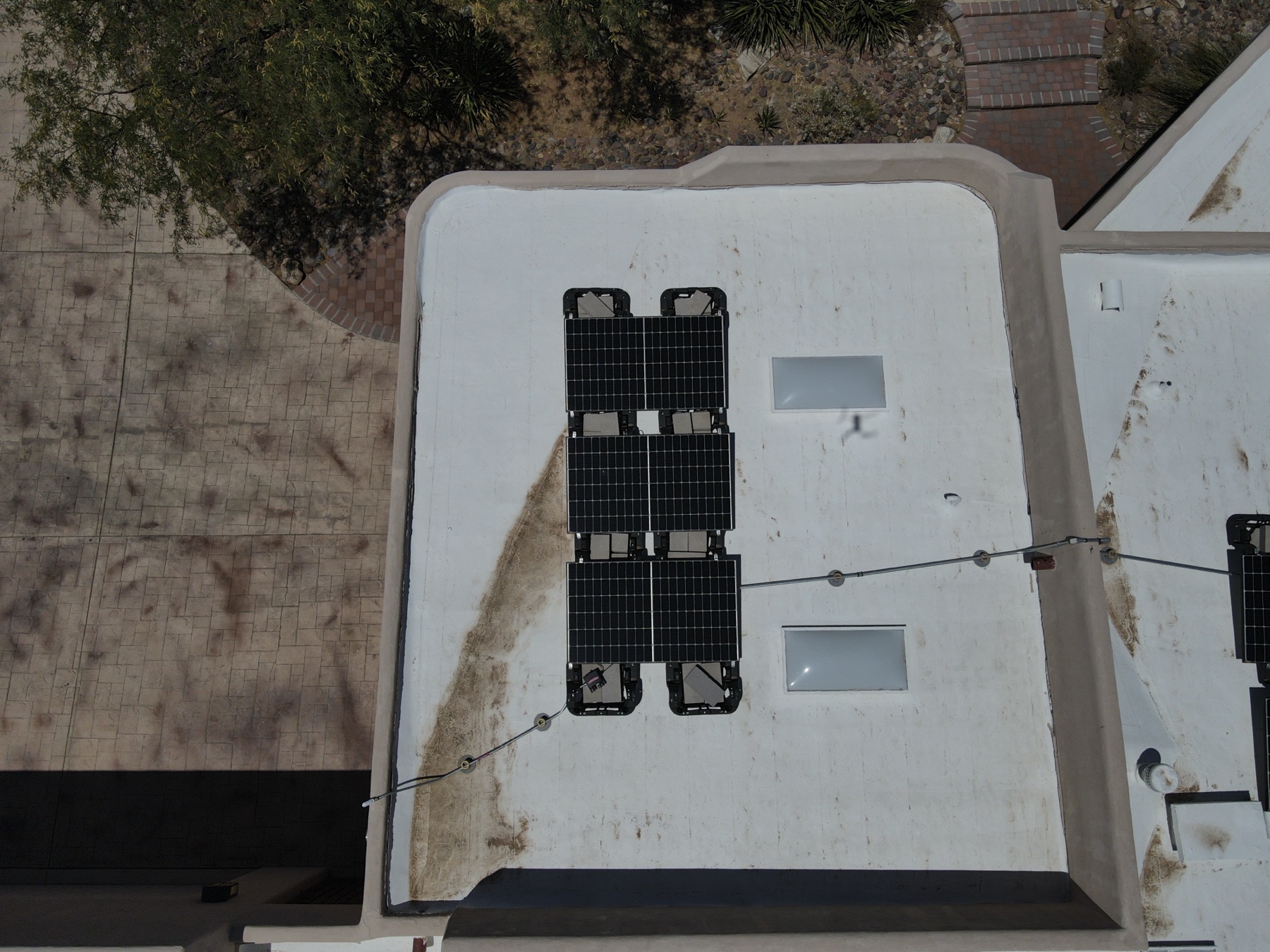 drone solar panel inspection tucson — certified drone over rooftop solar array