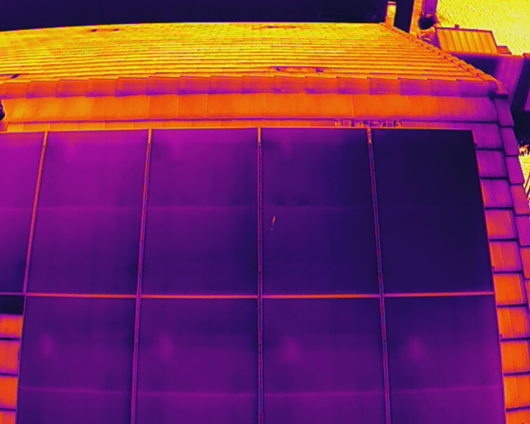 Radiometric thermal drone image of rooftop solar panels in Tucson showing heat signature differences between modules