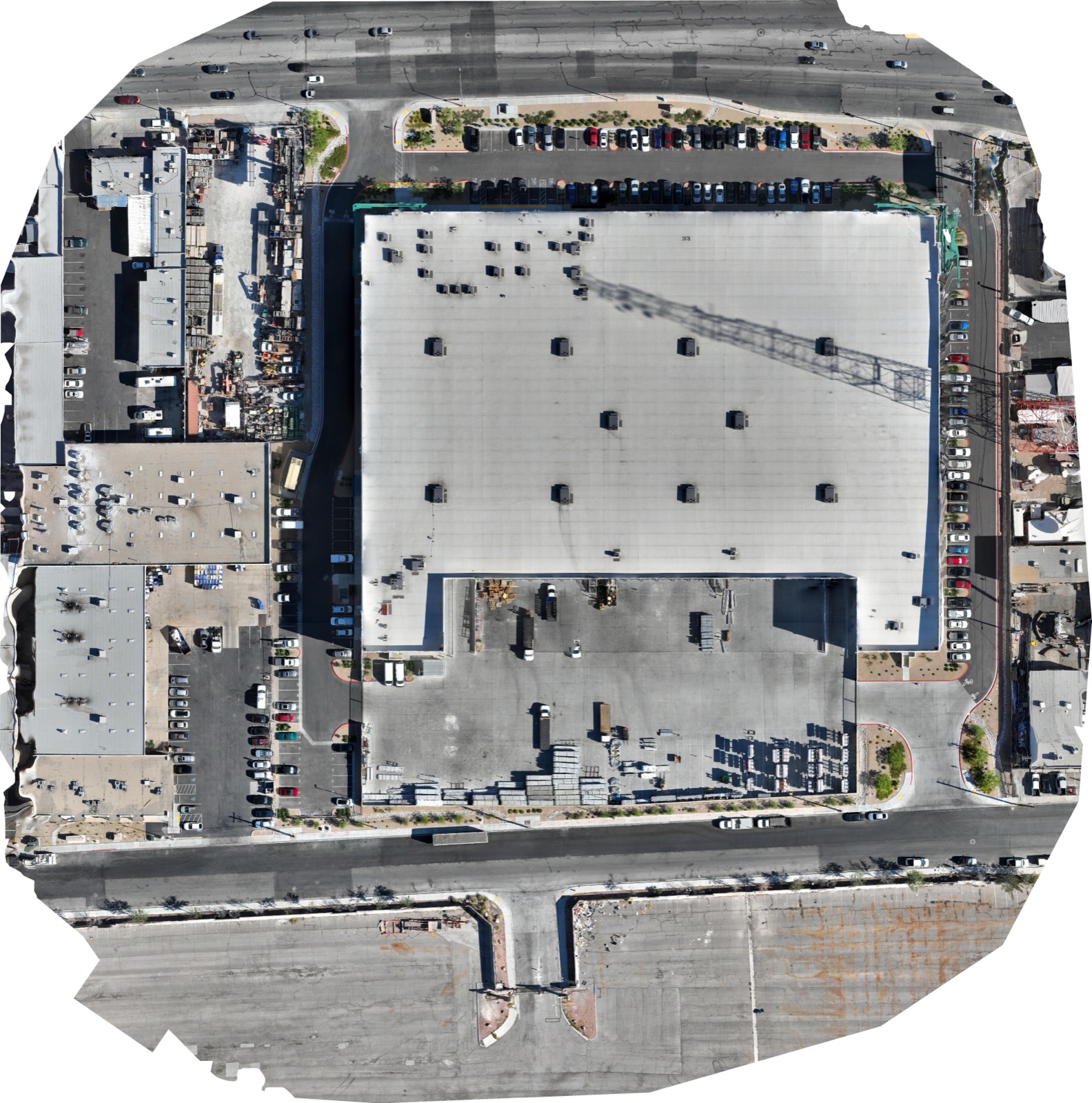 Top-down drone orthomosaic of a commercial warehouse roof used as a survey baseline